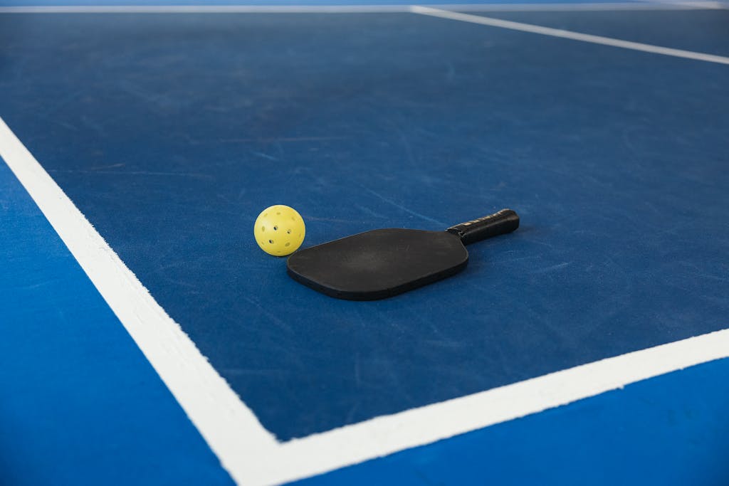 Paddle and Ball on Court